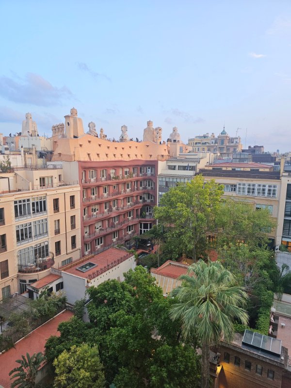 The View of La Pedrera from the H10 Casa Mimosa Rooftop Bar