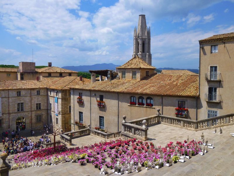 Girona During the Flower Festival - with historic buildings and a carpet of pink flowers leading down the cathedral steps