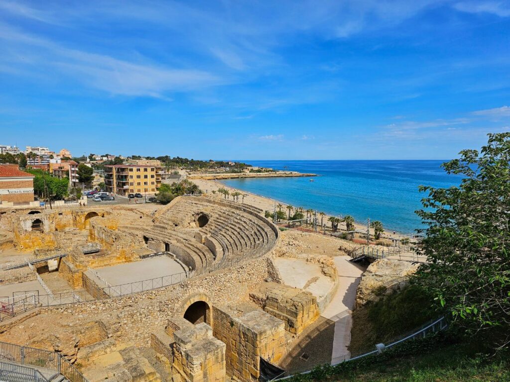The Roman Amphitheatre in Tarragona with the sea behind - A Perfect Tarragona Day Trip from Barcelona