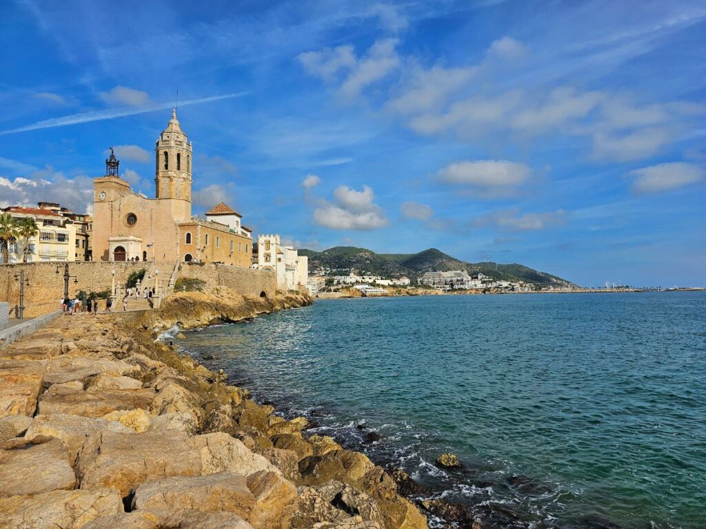 The Church of Sant Bartomeu and Santa Tecla in Sitges next to the sea - Day Trip from Barcelona to Sitges