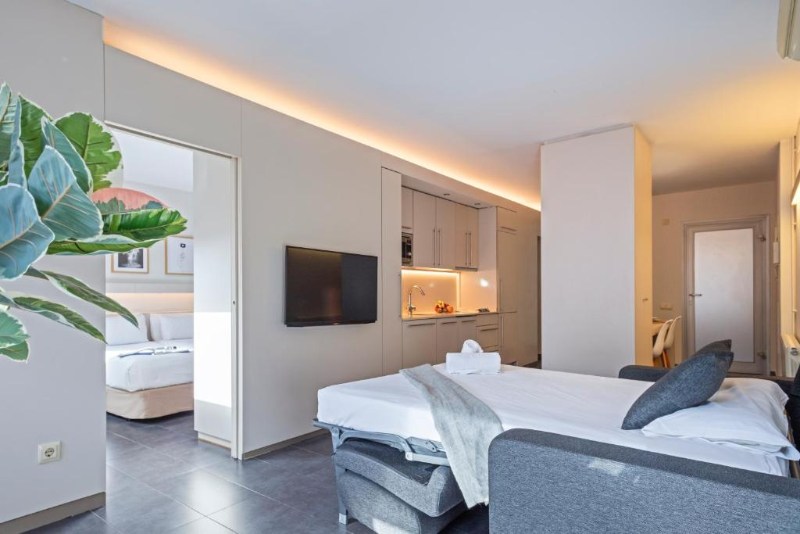 An Apartment at ApartHotel BCN Montjuic with a bedroom and sofa bed