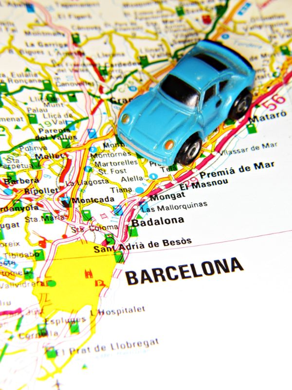 Map of Spain showing Barcelona with a toy car - Car Rental in Barcelona