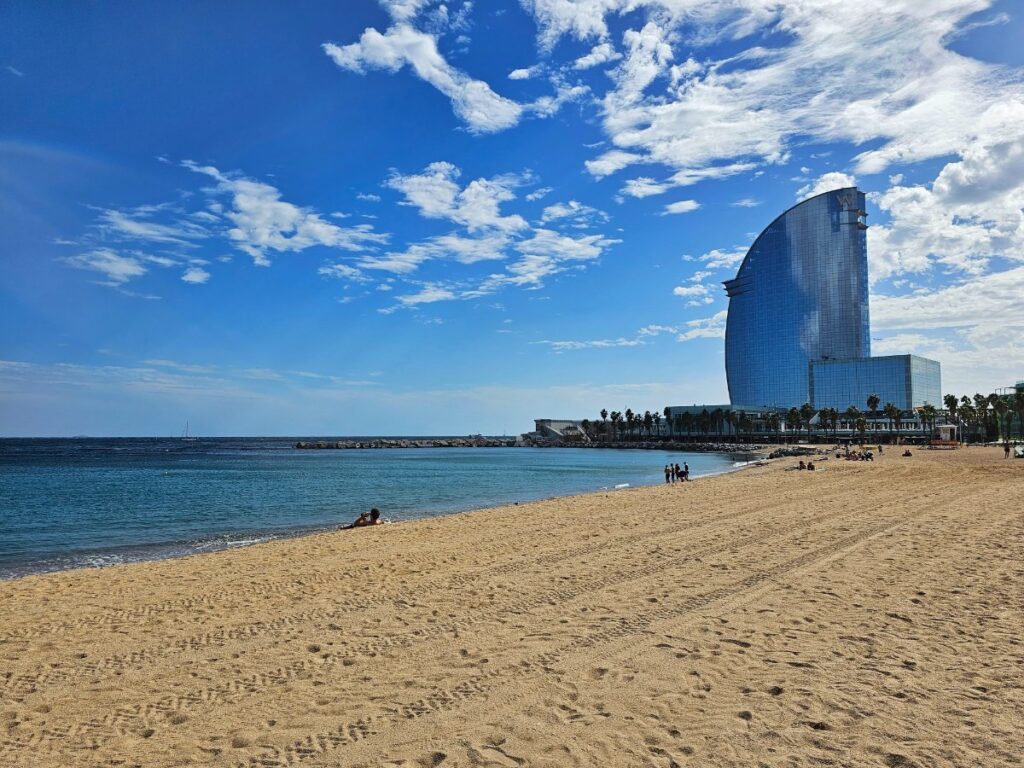 Barceloneta Beach in Barcelona with the W Hotel at the end of the beach - the Best Beaches in Barcelona